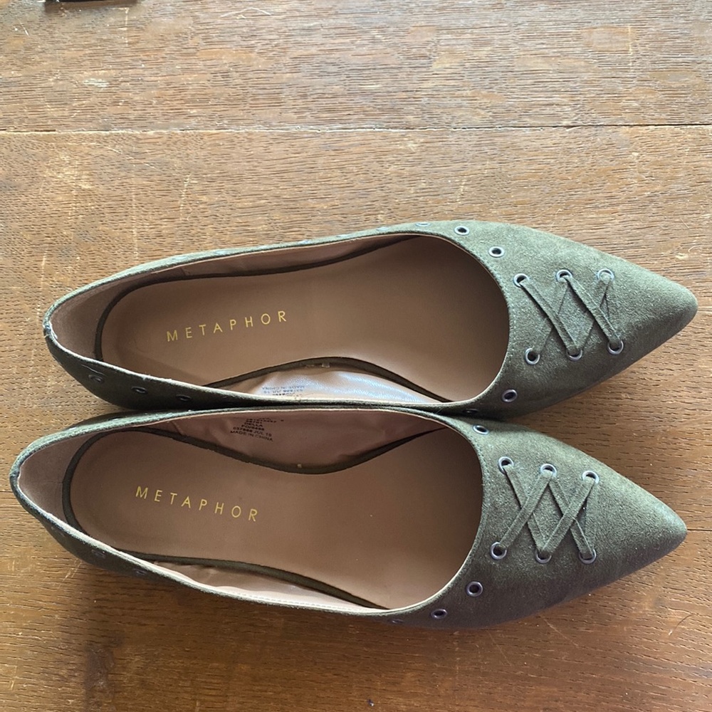 Green suede like flats with lace up and open stud decorations.
